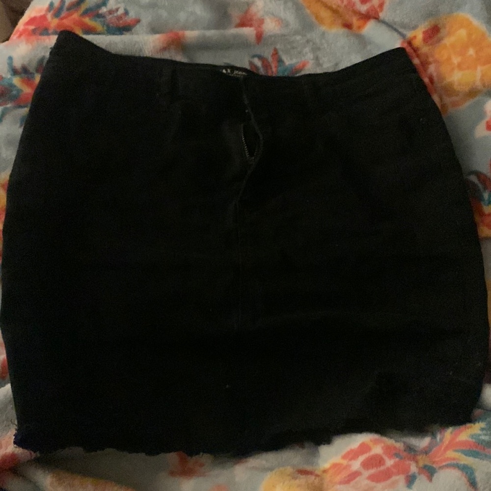 this is a cute black jean short high waisted skirt. barely worn.